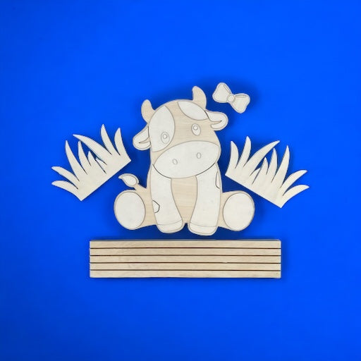 Unpainted interchangeable wooden decorative cow